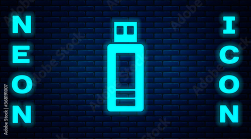 Glowing neon USB flash drive icon isolated on brick wall background. Vector.