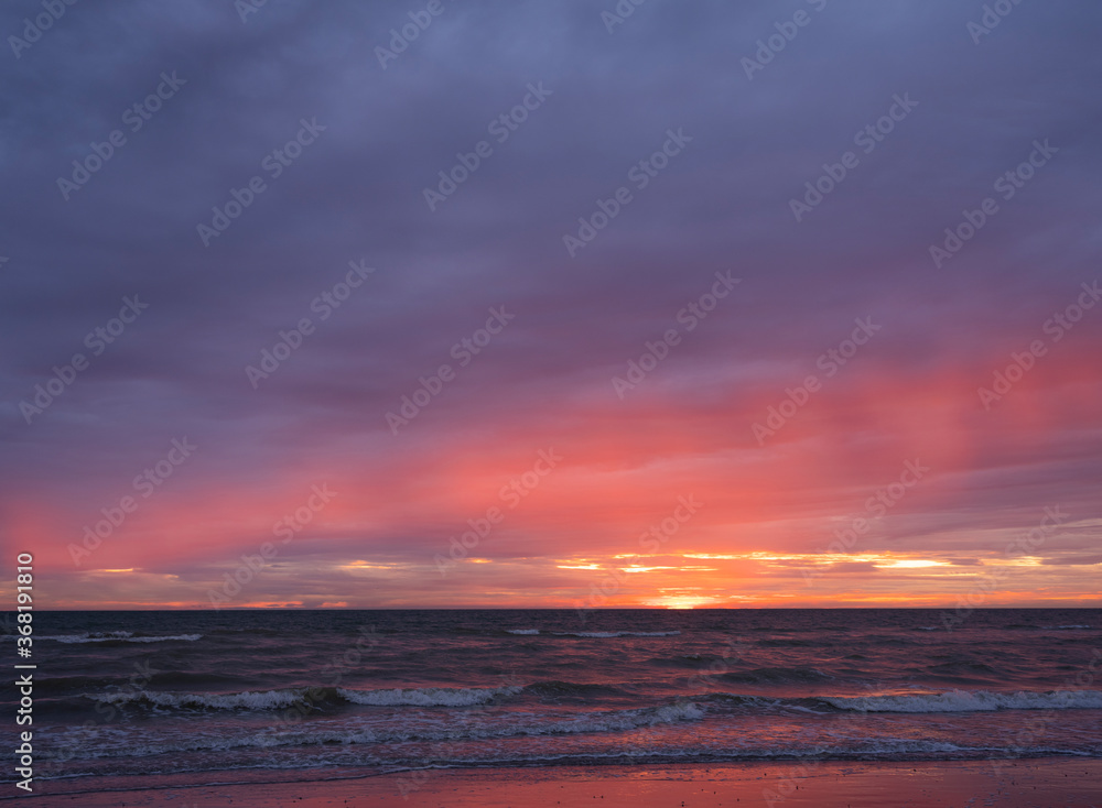 colorful sunset on beach of normandy in france