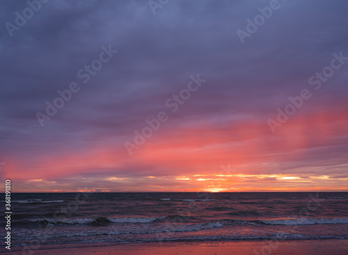 colorful sunset on beach of normandy in france