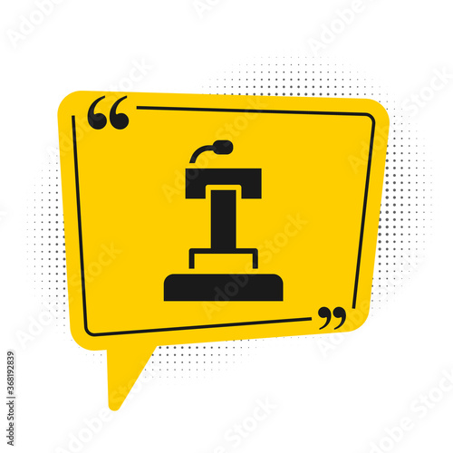 Black Stage stand or debate podium rostrum icon isolated on white background. Conference speech tribune. Yellow speech bubble symbol. Vector.