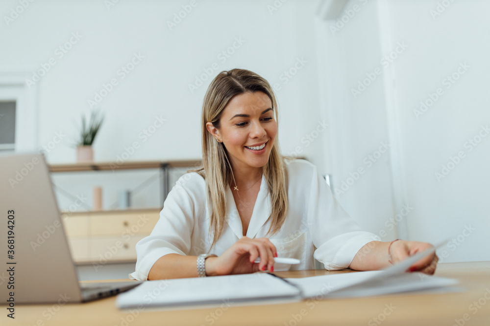 Cheerful businesswoman reading, close-up portrait. Cheerful businesswoman reading, close-up portrait.