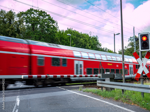 Obraz na plátně train in motion at the level crossing