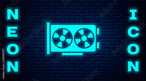 Glowing neon Video graphic card icon isolated on brick wall background. Vector.