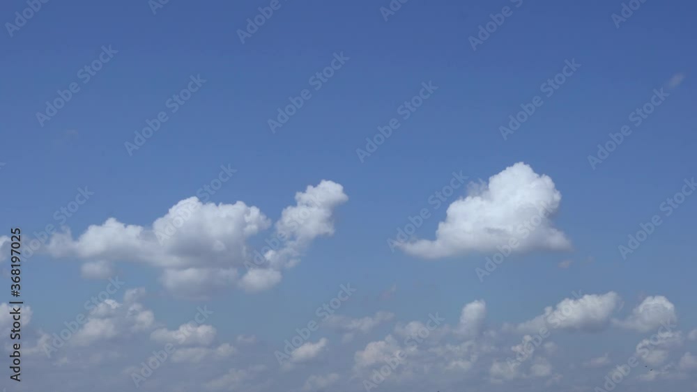 Cumulus and Stratified-Cumulus Clouds in the Blue Sky during the Day. Sky and Clouds 4k. Background of Sky and Clouds. Cumulus and Stratified-Cumulus Clouds in the Blue Sky during the Day. Sky and Clouds 4k. Background of Sky and Clouds.