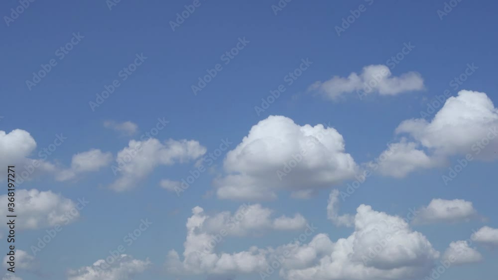 White Fluffy Clouds in a Clear Blue Sky. Clouds and Sky 4k. Time Lapse Of Clouds During The Day. White Fluffy Clouds in a Clear Blue Sky. Clouds and Sky 4k. Time Lapse Of Clouds During The Day.
