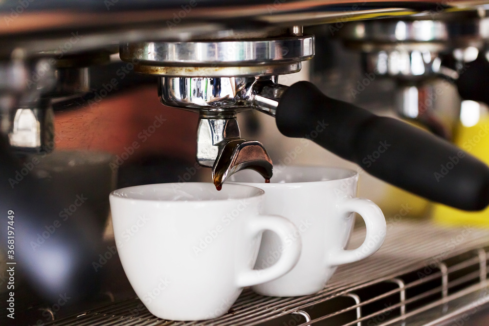 Making coffee in the coffee machine. Morning atmospheric lighting, fashionable trendy spot soft focus. Preparation for design creative menu. Making coffee in the coffee machine. Morning atmospheric lighting, fashionable trendy spot soft focus. Preparation for design creative menu.