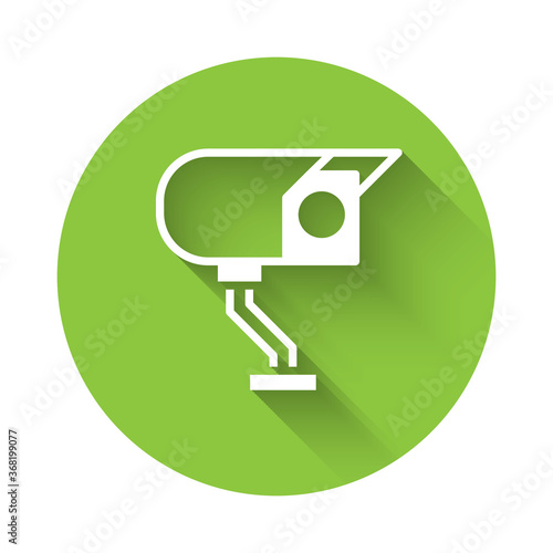 White Security camera icon isolated with long shadow. Green circle button. Vector.
