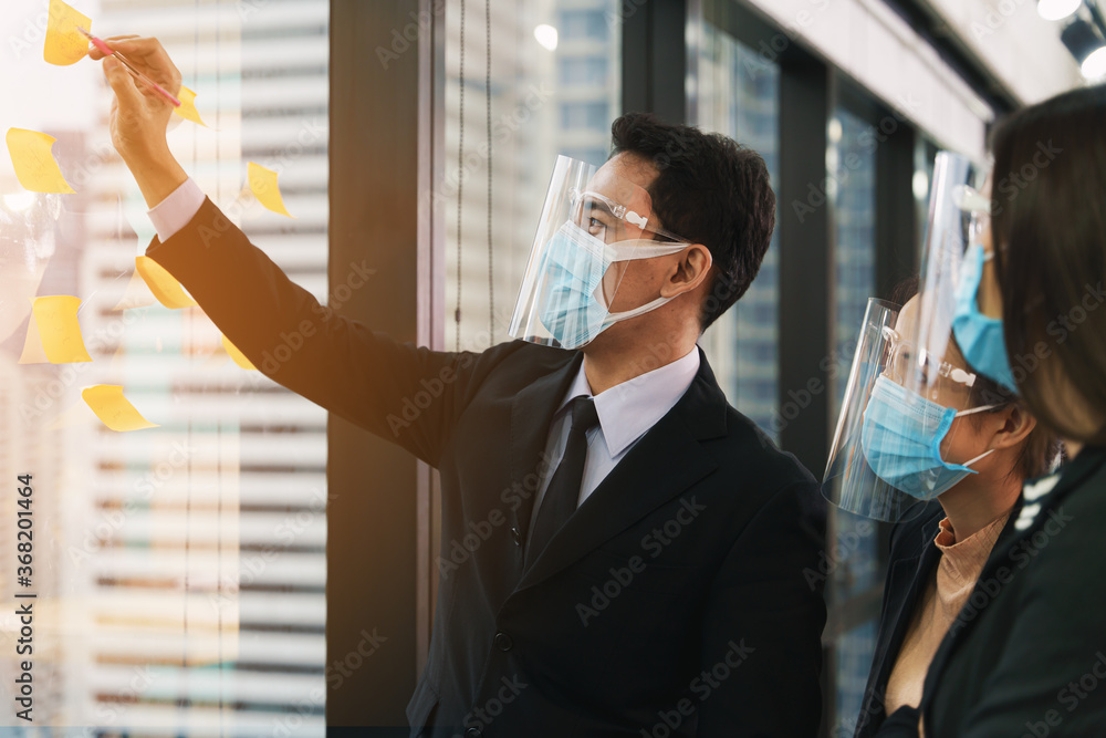 business new normal to protect coronavirus covid-19 to work in office business new normal to protect coronavirus covid-19 to work in office