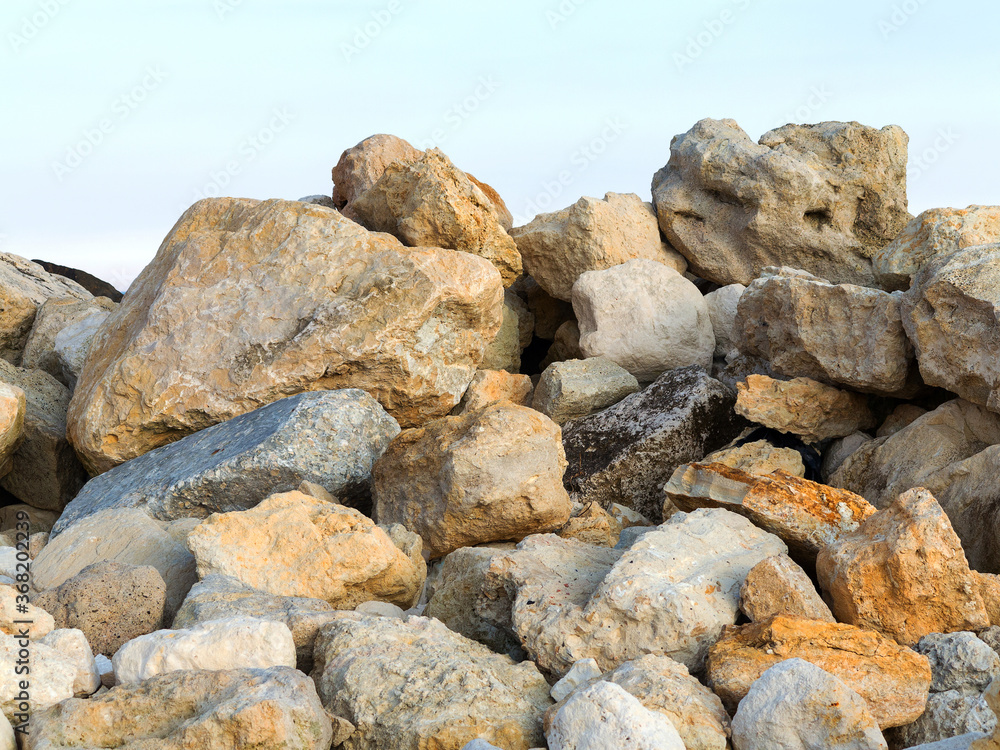 Large stones on the stone beach in the background Large stones on the stone beach in the background