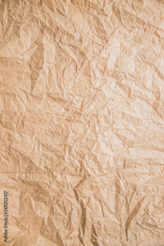 Crumpled beige paper detailed texture. Copy space  top view