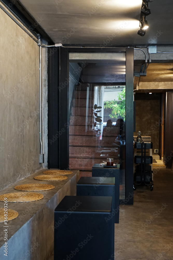 Interior bar design and decoration at coffee cafe, bakery shop and hostel decorated with wooden furniture, loft wall and weaving goods- Chiang mai, Thailand