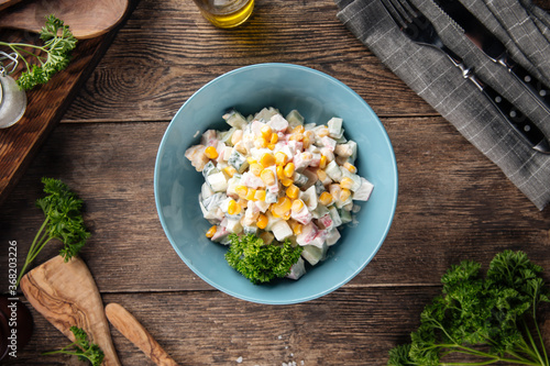 Russian salad with crab sticka and corn