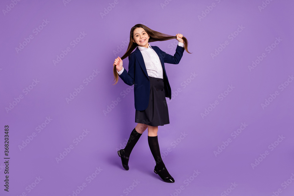 Full length body size profile side view of her she nice attractive lovely cheerful cheery long-haired girl making tails going back isolated violet lilac purple pastel color background Full length body size profile side view of her she nice attractive lovely cheerful cheery long-haired girl making tails going back isolated violet lilac purple pastel color background