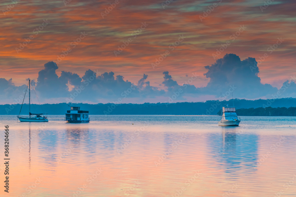 Sunrise Waterscape with High Cloud and Boats