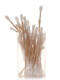 Wooden cotton buds, swabs for ear cleaning in plastic transparent container isolated on white background