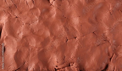 Foto Red modelling clay, playdough surface, texture and background