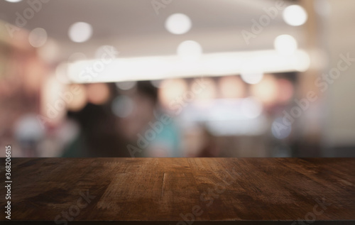 Wood Table Top in Blur Background room interior with empty copy space.