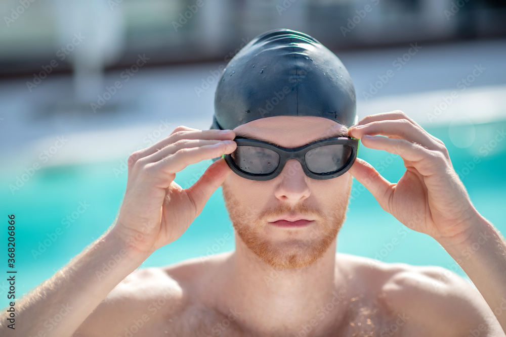 Close-up face of man in swimming goggles Close-up face of man in swimming goggles