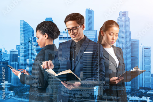 Photography Group of three business colleagues in suits working on project together to gain new career opportunities