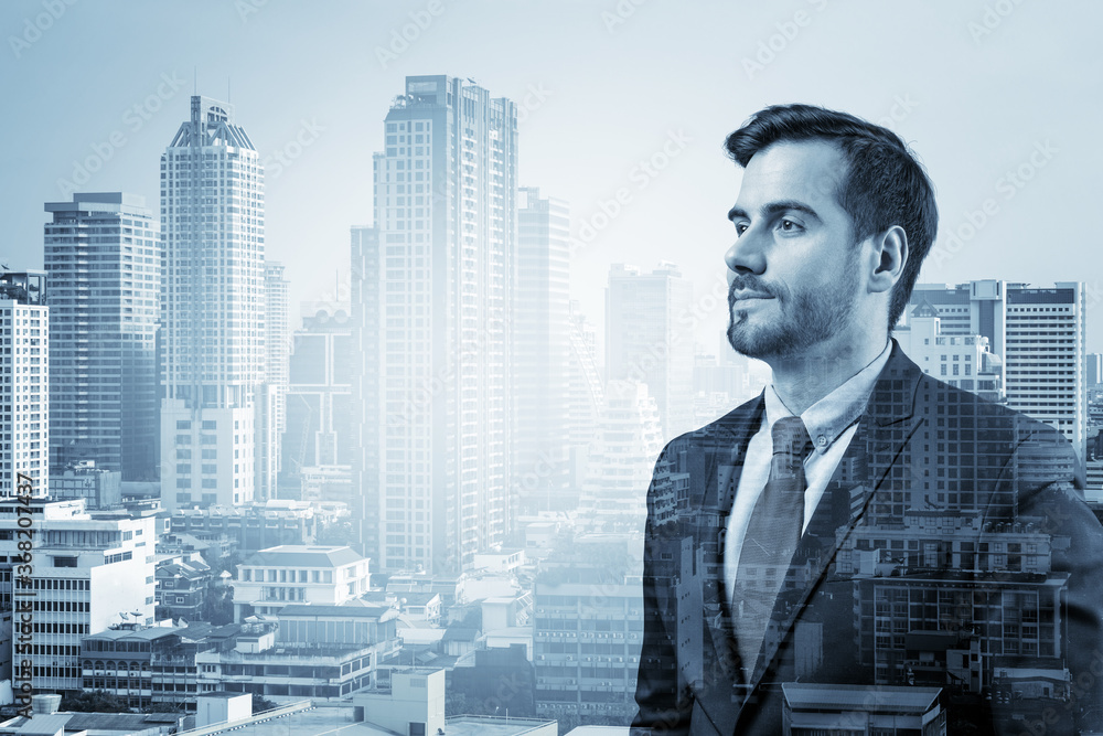 Young handsome businessman in suit thinking how to succeed, new career opportunities, MBA. Bangkok on background. Double exposure. Young handsome businessman in suit thinking how to succeed, new career opportunities, MBA. Bangkok on background. Double exposure.