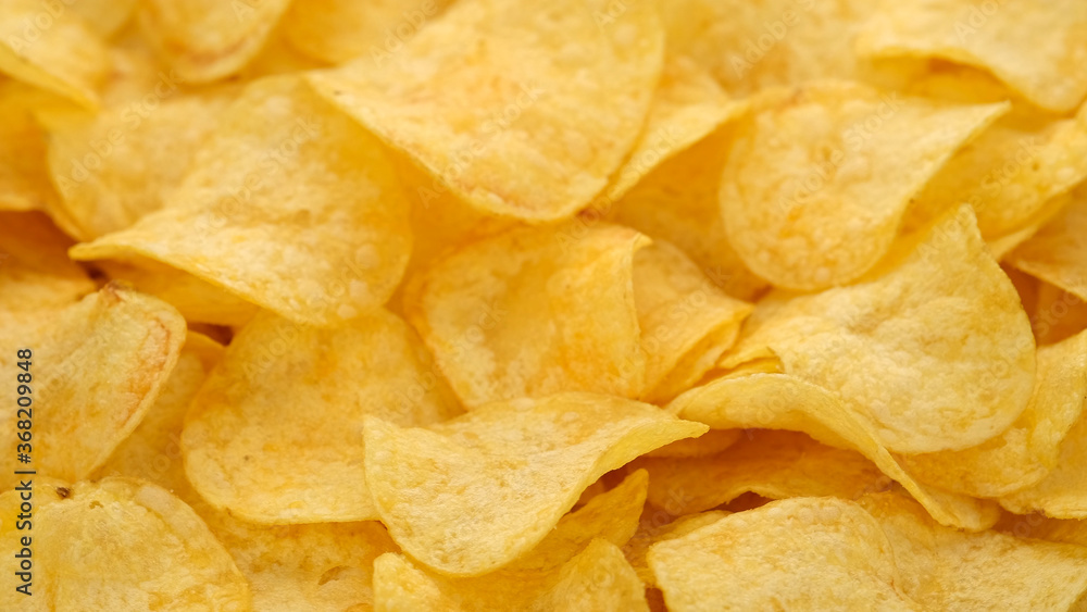 craft potato chips with cheddar cheese, close up craft potato chips with cheddar cheese, close up