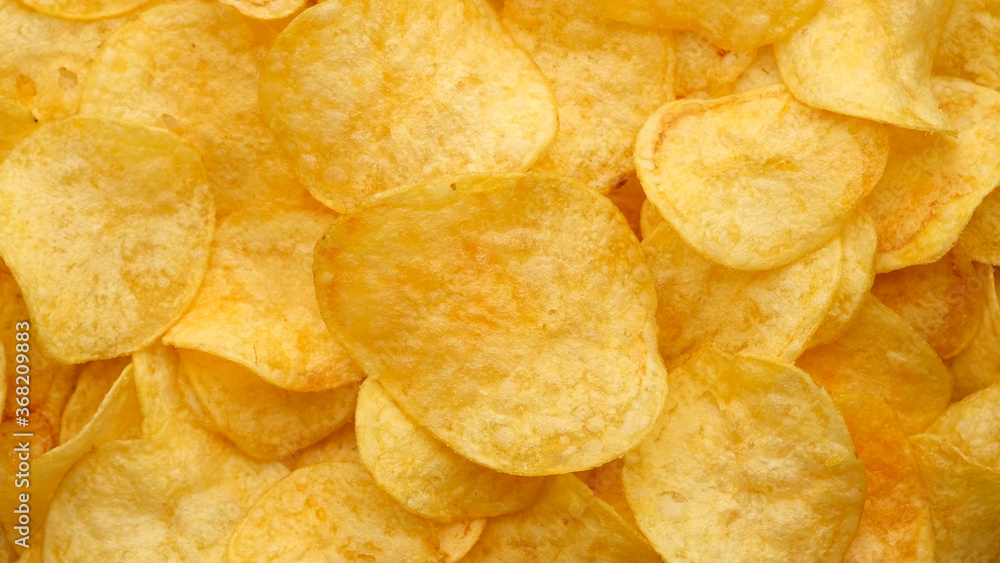 craft potato chips with cheddar cheese, close up craft potato chips with cheddar cheese, close up