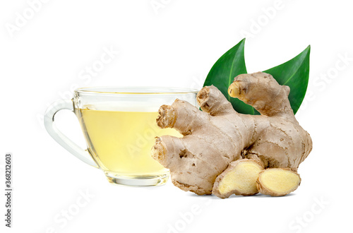 ginger tea in glass cup and leaves isolated on white background