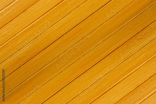 Natural oblique yellow wood background in the upper corner of the photo text area for advertising
