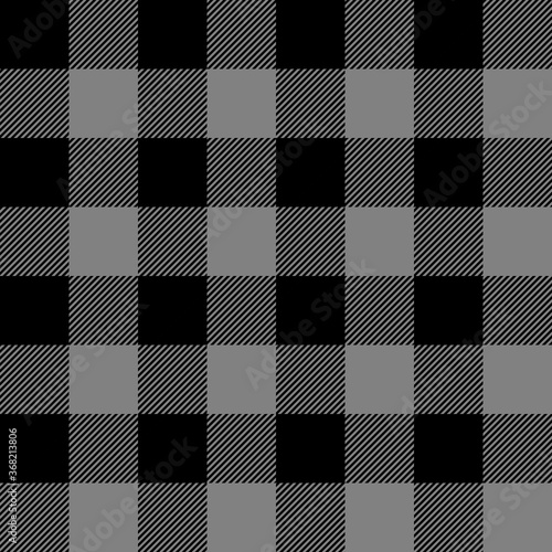 Tartan plaid. Scottish pattern in black and gray cage. Scottish cage. Traditional Scottish checkered background. Seamless fabric texture. Vector illustration
