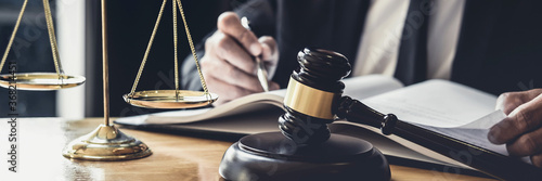 Photography Male lawyer or judge working with contract papers