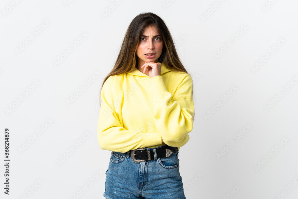 Young caucasian woman isolated on white background having doubts and thinking Young caucasian woman isolated on white background having doubts and thinking