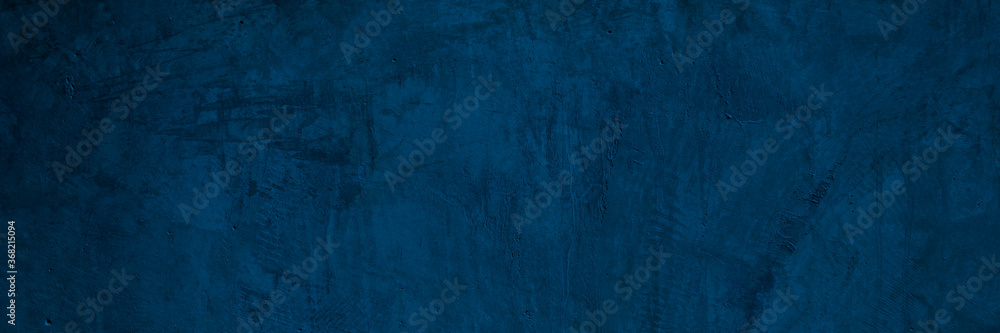 Texture of a old grungy blue concrete wall with cracks as a background or wallpaper Texture of a old grungy blue concrete wall with cracks as a background or wallpaper