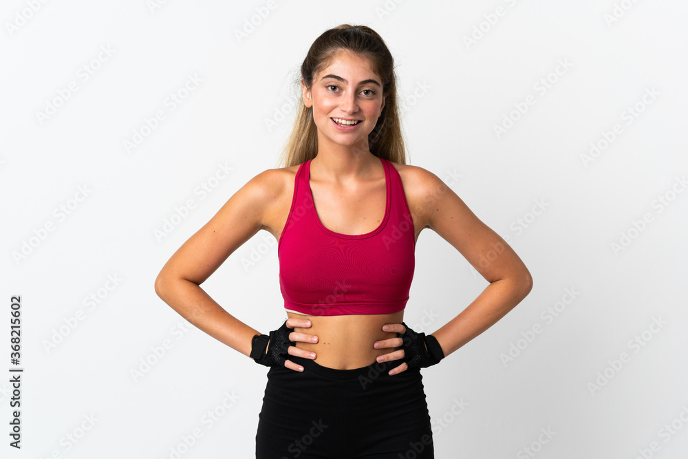 Young caucasian woman isolated on white background posing with arms at hip and smiling Young caucasian woman isolated on white background posing with arms at hip and smiling