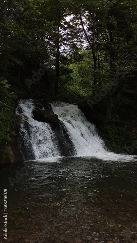 Fototapeta Naklejka Na Ścianę i Meble -  Mystical waterfall in the dark forest