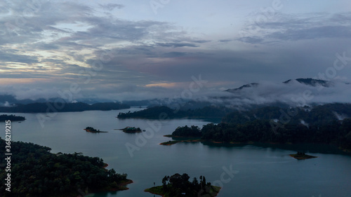 Aerial view of Kenyir Lake during blue hour sunrise. © ellinnur