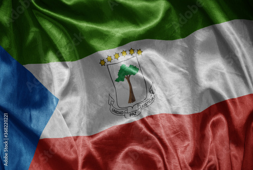 colorful shining big national flag of equatorial guinea on a silky texture