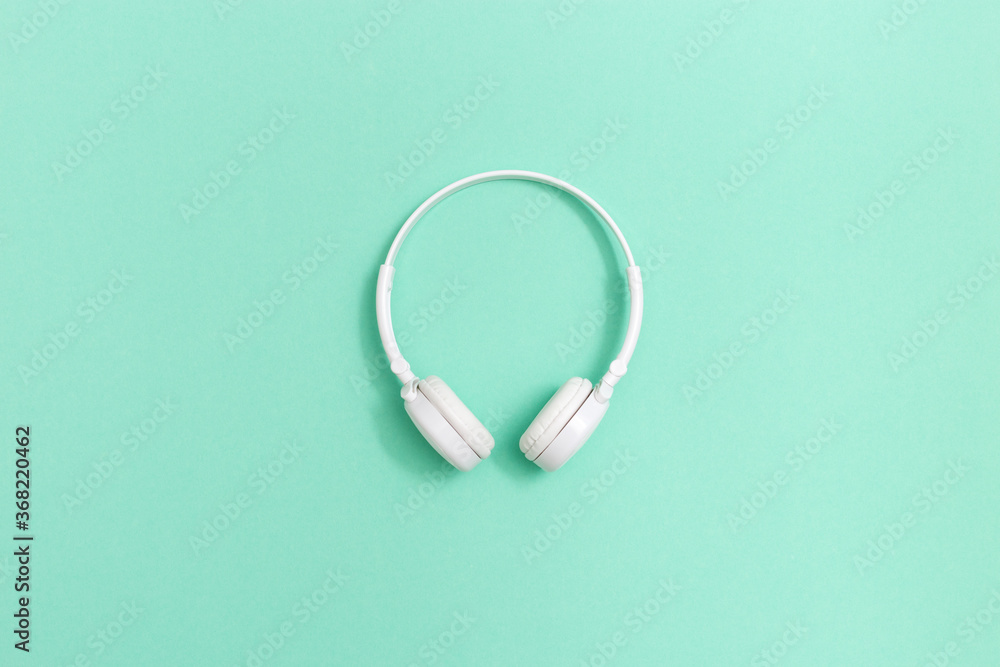 White headphones on mint colored paper background. Music concept. Dj Headset.  Minimal style. Stock Photo | Adobe Stock