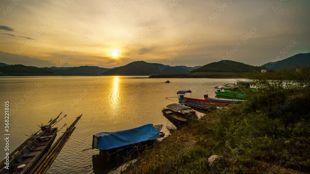 4K Time lapse of fishing boats on a tropical river with beautiful sunset in Thailand 4K Time lapse of fishing boats on a tropical river with beautiful sunset in Thailand