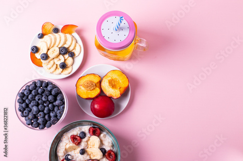 porridge, fruit and berries as healthy yummy breakfast concept