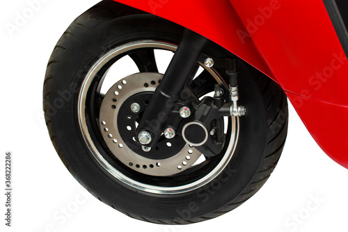 Part of a red scooter with a wheel and brakes