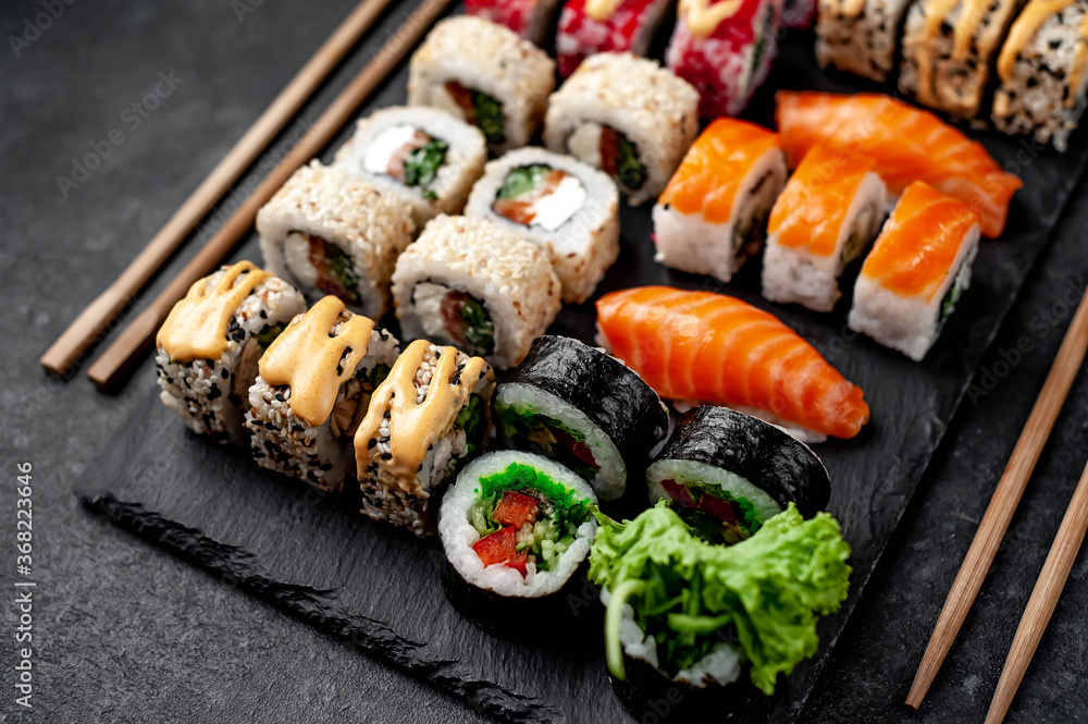 Sushi set on a stone background. Japanese food Sushi set on a stone background. Japanese food