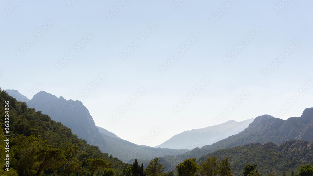 Fototapeta premium incredibly beautiful landscape against the backdrop of majestic mountains