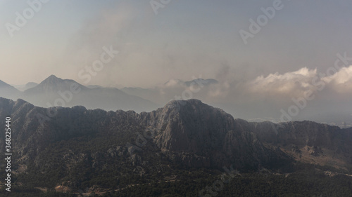 majestic mountains covered with clouds and fog