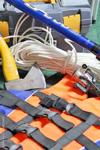 Fishing kit: fishing rod, life jacket, axe, rope.