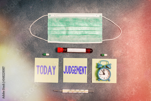 Handwriting text writing Judgement. Conceptual photo process of forming an evaluation by discerning and comparing Extracted blood sample vial with medical accessories ready for examination photo