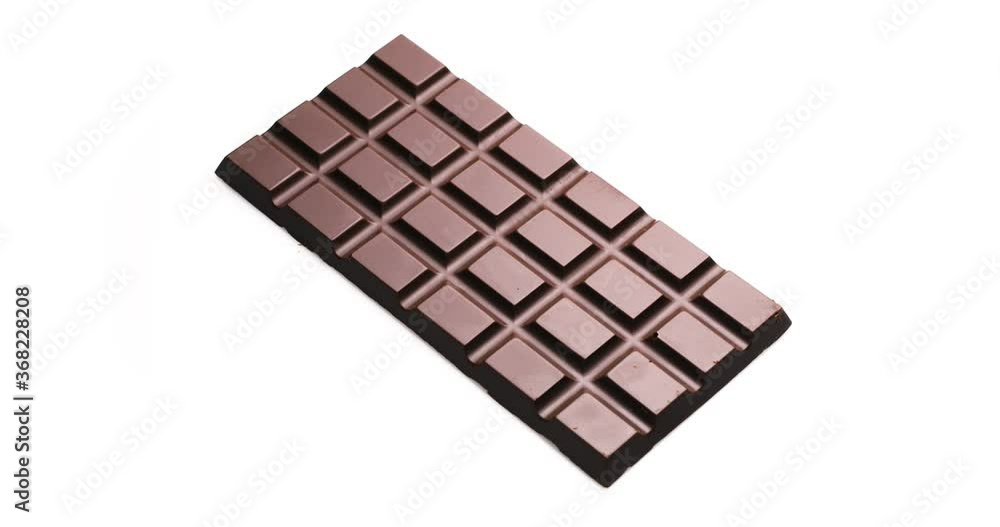 Whole bar of chocolate isolated on white background, rotates 360 degrees clockwise. Whole bar of chocolate isolated on white background, rotates 360 degrees clockwise.