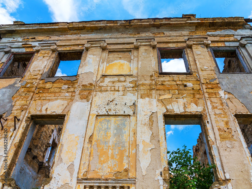 The ruins of an ancient house in Odessa, Ukraine. Historic building destroyed by vandals of the proletariat during a revolution in Russia in the 20th century.