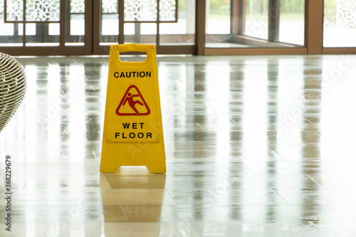 Mopping wet floor in lobby hotel. Background for caution wet floor.