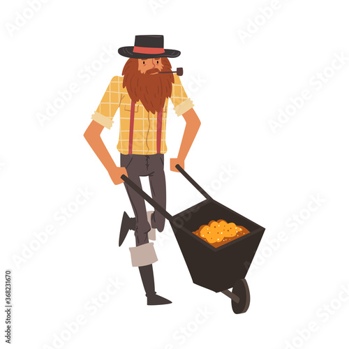 Male Prospector with Wheelbarrow full of Gold, Bearded Gold Miner Character Wearing Vintage Clothes and Hat Smoking Pipe Cartoon Style Vector Illustration