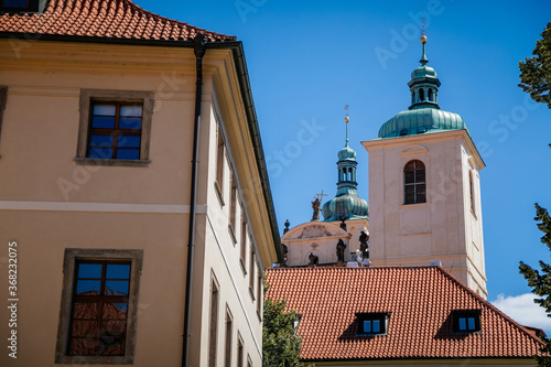 The tower and spiers of the Church of St. James the Greater, view from Ungelt (Týn Yard), Old Town, Prague, Czech Republic photo